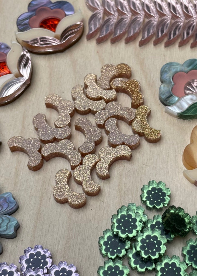 Collection of decorative ceramic pieces on a textured surface