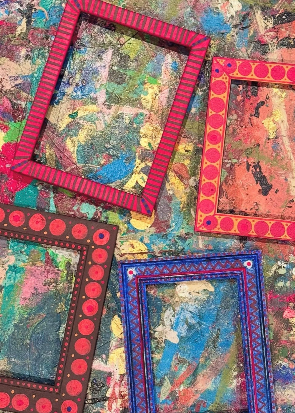 Colorful art frames on a textured surface