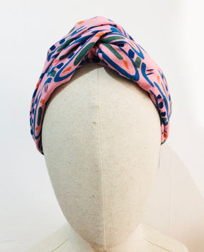 The Twist Headband in 'Hungry Bugs on Pink'