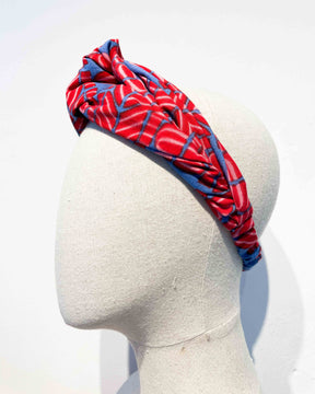 The Twist Headband in Flamingo Splits on Blue